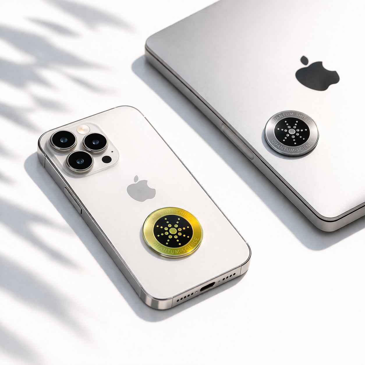 PureWave EMF shield applied to iPhone and MacBook